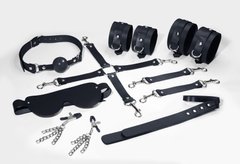 Набір Feral Feelings BDSM Kit 7 Black, наручники, поножі, конектор, маска, падл, кляп, затискачі